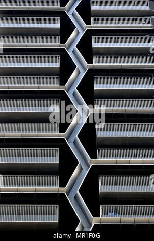 Front view of modern exterior of unique multi story car park in downtown Singapore with stunning textures of steel and geometric patterns Stock Photo