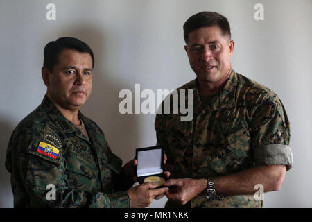Colonel Ronier Ramirez, Ecuador (Left), presents Colonel Sean Killeen ...