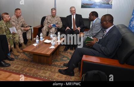 U.S. Africa Command commander U.S. Marine Corps Gen. Thomas D. Waldhauser, and the U.S. Ambassador to Somalia Stephen Schwartz, center, meet with the Special Representative of the Chairperson of the African Union Commission for Somalia Ambassador Francisco Caetano Jose Madeira at Mogadishu International Airport, Somalia, April 29, 2017. Waldhauser has stated that the U.S. and its African partners should bring forward creative and viable solutions to meet the complicated and diverse challenges facing the African continent. (U.S. Air National Guard photo by Tech. Sgt. Andria Allmond) Stock Photo