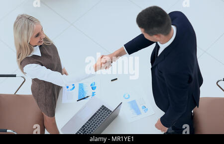 handshake colleagues after drawing up a new financial plan Stock Photo