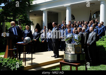 President Donald Trump congratulates the U.S. Air Force Academy football team with the Commander-in-Chief's Trophy at the White House May 2, 2017. With the team were Lt. Gen. Michelle D. Johnson, the superintendent of the U.S. Air Force Academy, Acting Secretary of the Air Force Lisa S. Disbrow and Air Force Chief of Staff Gen. David L. Goldfein. (U.S. Air Force photo/Staff Sgt. Jannelle McRae)