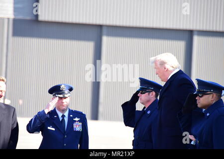 Col. Keith Allbritten, commander of the 118th Wing, salutes President Donald Trump as he deplanes Air Force One on March 15, 2017 at Berry Field Air National Guard Base, Nashville, Tennessee. Trump made the visit to Tennessee to visit President Andrew Jackson's home and to speak at a political rally. (U.S. Air National Guard Photo by Master Sgt. Jeremy Cornelius)