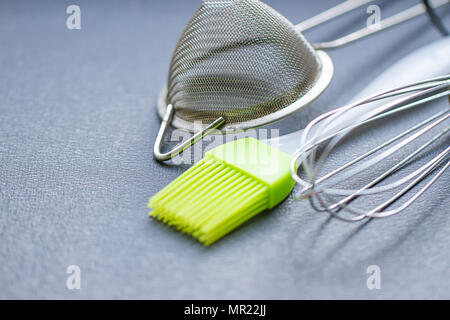 Background of kitchen utensils : Culinary brush, whisk spatula Stock Photo