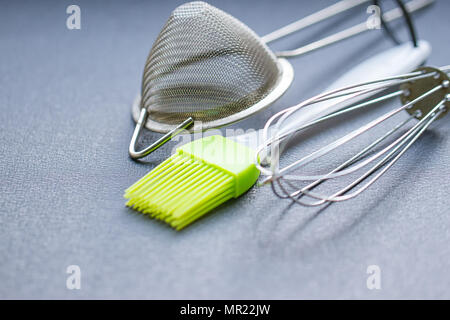 Background of kitchen utensils : Culinary brush, whisk spatula Stock Photo