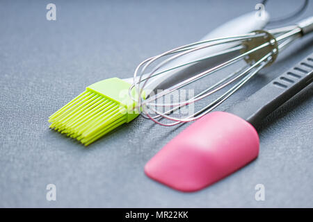 Background of kitchen utensils : Culinary brush, whisk spatula Stock Photo
