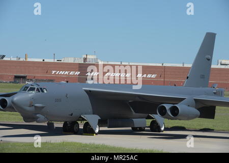 Boeing B-52H, 60-0005, poses in front of Oklahoma City Air Logistics Complex Bldg. 3001 following major overhaul on May 1, 2017, Tinker Air Force Base, Oklahoma. OC-ALC is responsible for depot level maintenance of the B-52 fleet with a large portion of the work taking place in the building shown behind. (U.S. Air Force photo/Greg L. Davis) Stock Photo