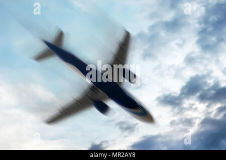 aerophobias concept. plane shakes during turbulence flying air hole. Blur image commercial plane moving fast downwards. Fear of flying. collapse slump Stock Photo