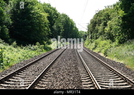 double-track railroad railway or train tracks in rural Germany, travel concept background with copy space Stock Photo