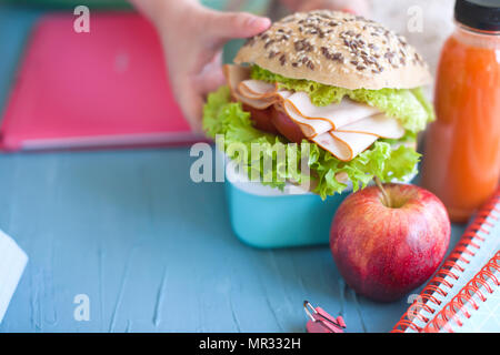 Sandwich for school lunch, books. Place for text Stock Photo