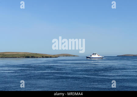 The Yell ferry that connects the mainland of Shetland to the island of Yell. Dropping off passengers and cars to the ferry terminal Stock Photo