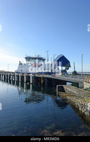 The Yell ferry that connects the mainland of Shetland to the island of Yell. Dropping off passengers and cars to the ferry terminal Stock Photo