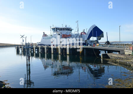 The Yell ferry that connects the mainland of Shetland to the island of Yell. Dropping off passengers and cars to the ferry terminal Stock Photo