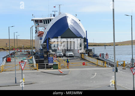 The Yell ferry that connects the mainland of Shetland to the island of Yell. Dropping off passengers and cars to the ferry terminal Stock Photo