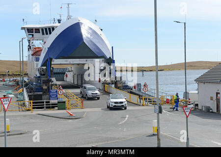 The Yell ferry that connects the mainland of Shetland to the island of Yell. Dropping off passengers and cars to the ferry terminal Stock Photo