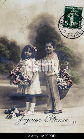 French Happy New Year, postcard depicting two small children circa 1900 Stock Photo