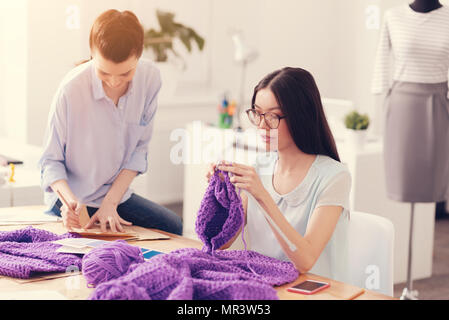 Concentrated tailors working in the atelier Stock Photo