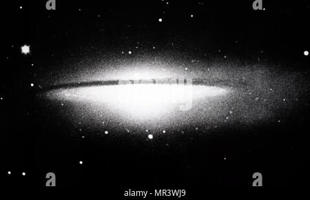 Photograph of a spiral galaxy in coma bernices seen edge-on, showing central plane of obscuring matter. Photographed by James Edward Keeler with the Crossley 36-inch reflector at Lick Observatory. James Edward Keeler (1857-1900) an American astronomer. Dated 20th century Stock Photo