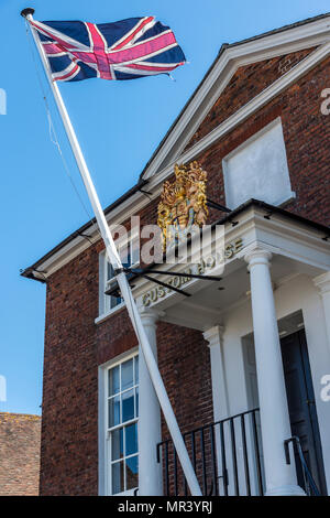 Street scene with the Union Jack flag at the Old Customs House building on Poole harbour promenade and its links with the sea. Stock Photo