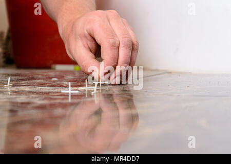 Plastic crosses for laying tiles on the floor 2018 Stock Photo