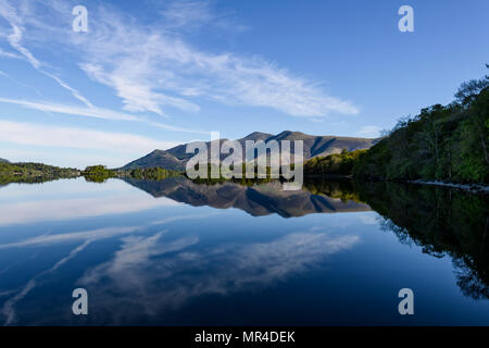 The view from Barrow Bay of the Skiddaw range in early morning spring sunshine reflected in Derwent Water Stock Photo