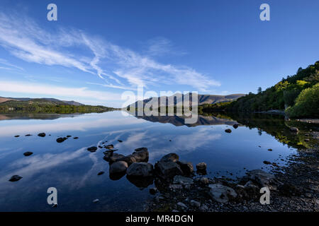The view from Barrow Bay of the Skiddaw range in early morning spring sunshine reflected in Derwent Water Stock Photo