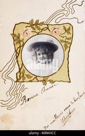 Vintage French postcard showing a smiling young girl 1900 Stock Photo