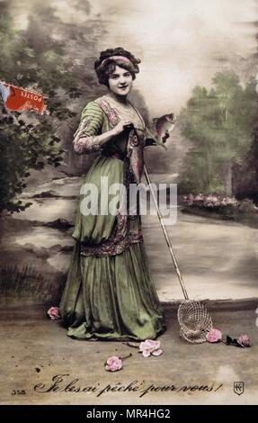 Vintage, French, postcard  depicting a woman, holding fish. 1900 Stock Photo