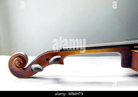 The violin on the table, Close up of violin on the wooden floor, Top view of violin musical on dark wooden floor Stock Photo