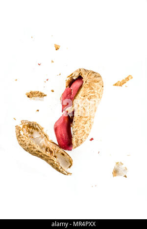 Whole and open peanut nuts isolated on a white background Stock Photo