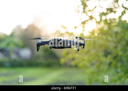 Flying quadrocopter, remote controlled drone with camera Stock Photo