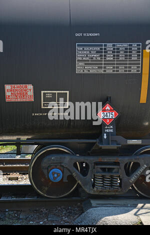 Rail tanker cars carrying flammable gasoline pass through a Chicago south side neighborhood. Stock Photo