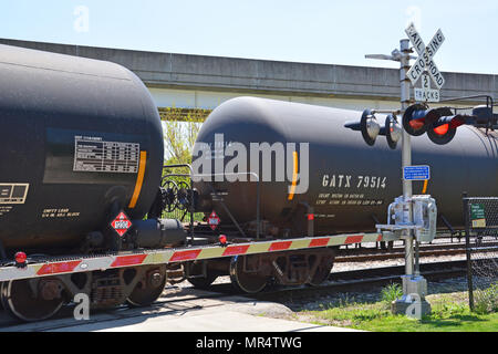 Rail tanker cars carrying flammable methanol pass through a Chicago south side neighborhood. Stock Photo