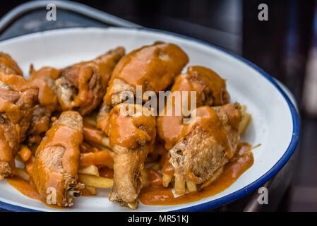 Close up of spicy chicken wings in tapas bar. Stock Photo