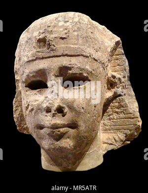 Colossal head from a Royal statue from Ancient Egypt. Built from Numulitic stone from Alexandria. Dated 300 BC Stock Photo