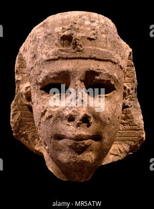 Colossal head from a Royal statue from Ancient Egypt. Built from Numulitic stone from Alexandria. Dated 300 BC Stock Photo