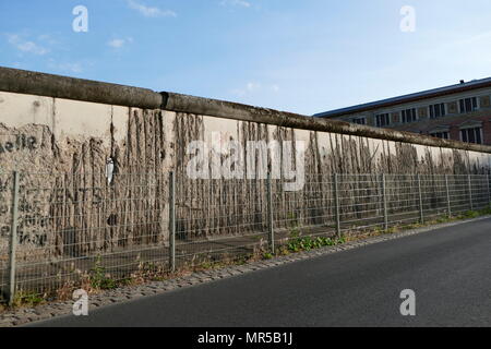 The Berlin Wall was a guarded concrete barrier that physically and