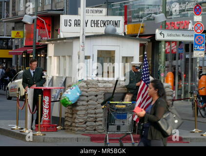 Photograph of Checkpoint Charlie (or 'Checkpoint C') was the name given by the Western Allies to the best-known Berlin Wall crossing point between East Berlin and West Berlin during the Cold War (1947–1991). Stock Photo