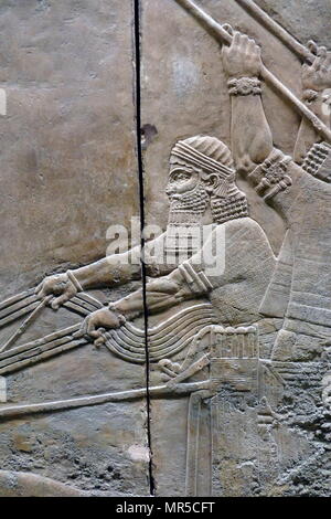 Assyrian wall relief depicting the royal lion hunt, of Ashurbanipal, the king. Assyrian, about 645-635 BC From Nineveh, North Palace. Stock Photo