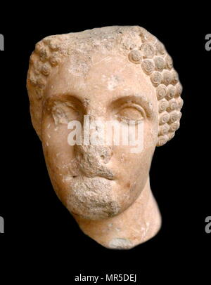 Head from a colossal statue of a woman wearing a sakkos (cap). Parían marble.  About 350 ВС. his portrait may represent one of the iemale members of the Hekatomnid dynasty. Ancient Greek Stock Photo