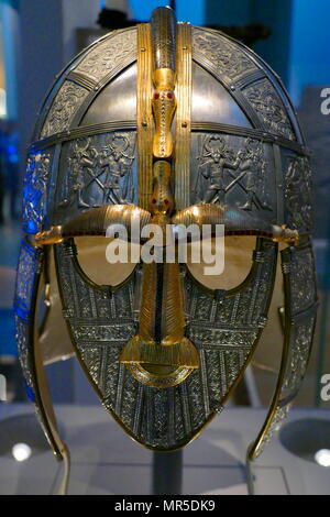 reconstruction of the Sutton Hoo helmet, a decorated Anglo-Saxon helmet discovered during the 1939 excavation of the Sutton Hoo ship-burial. Buried around 625 AD. it is believed to have been the helmet of King Raedwald; for whom its elaborate decoration may have given it a secondary function almost akin to a crown. Stock Photo