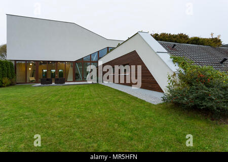 Futuristic villa exterior with roof garden and lawn Stock Photo