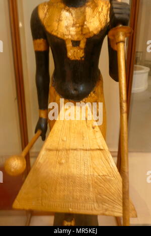 gilded wooden guardian statues from King Tutankhamen's burial chamber. Tutankhamen was an Egyptian pharaoh of the 18th dynasty (ruled c. 1332–1323 BC), during the period of Egyptian history known as the New Kingdom Stock Photo