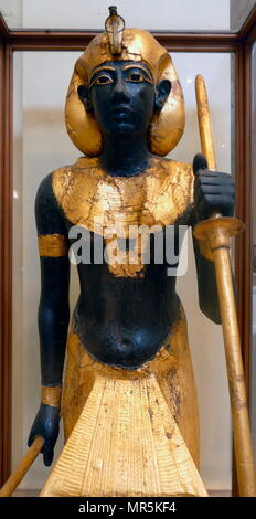 gilded wooden guardian statues from King Tutankhamen's burial chamber. Tutankhamen was an Egyptian pharaoh of the 18th dynasty (ruled c. 1332–1323 BC), during the period of Egyptian history known as the New Kingdom Stock Photo