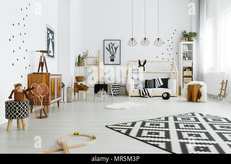 Child room in scandinavian style with house bed and carpet Stock Photo