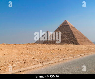 (Left) Pyramid of Khafre (Chephren) and Right, the Great Pyramid of Giza (Pyramid of Khufu; Pyramid of Cheops), in the Giza pyramid complex in Egypt. Stock Photo