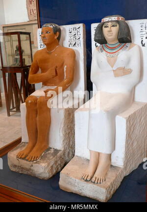 Painted limestone statue of Rahotep and Nofret. Prince Rahotep was a Prince in ancient Egypt during the 4th dynasty. He was probably a son of Pharaoh Sneferu. The statues were discovered in 1871 by Albert Daninos, an assistant to the French explorer and early archaeologist, Auguste Mariette. Their burial in a Mastaba located near the pyramid of Meidum shows they were members of the royal family of the Fourth Dynasty Stock Photo