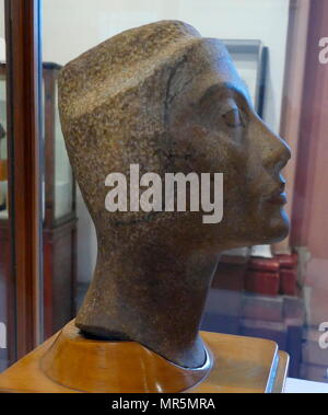 Unfinished, quartzite head of Queen Nefertiti, found at Tel el Amarna, workshop of Tutmosis. 1334 BC. Neferneferuaten Nefertiti was an Egyptian queen and the Great Royal Wife of Akhenaten, an Egyptian Pharaoh. Nefertiti and her husband were known for a religious revolution, in which they worshiped one god only, Aten, or the sun disc Stock Photo