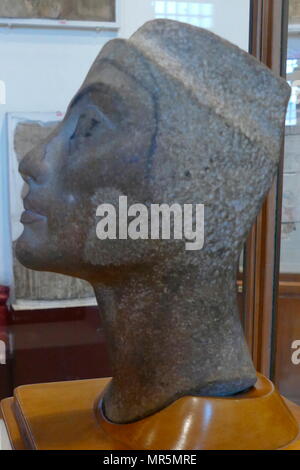 Unfinished, quartzite head of Queen Nefertiti, found at Tel el Amarna, workshop of Tutmosis. 1334 BC. Neferneferuaten Nefertiti was an Egyptian queen and the Great Royal Wife of Akhenaten, an Egyptian Pharaoh. Nefertiti and her husband were known for a religious revolution, in which they worshiped one god only, Aten, or the sun disc Stock Photo