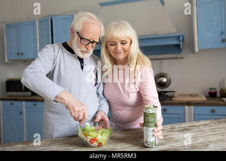 Senior couple cooking together. Stock Photo