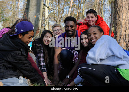 ahmaed cephus ramstein middle school advancement via individual determination avid instructor poses for a photo as he plants a tree with his students on ramstein air base germany april 21 2017 students celebrated earth day demonstrating support for environmental protection by planting trees us air force photo by airman 1st class savannah l waters mr5tw5